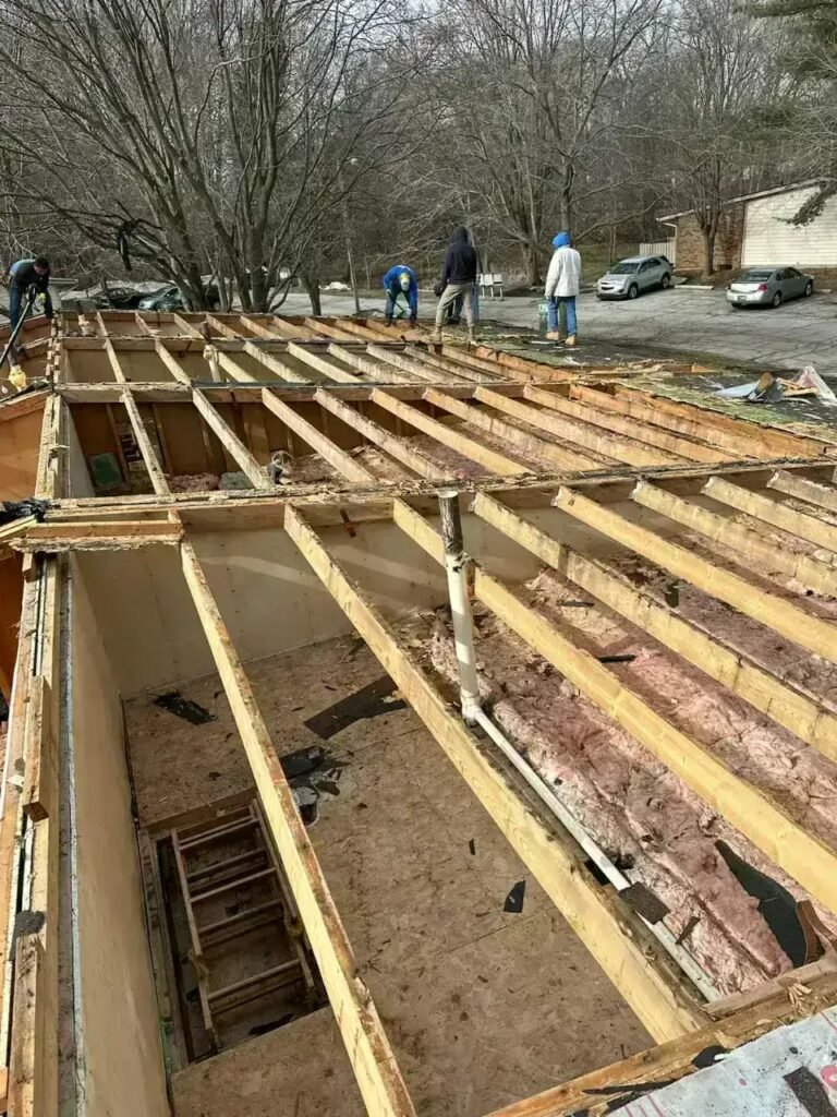 Inspecting roof, some people are inspecting the roof